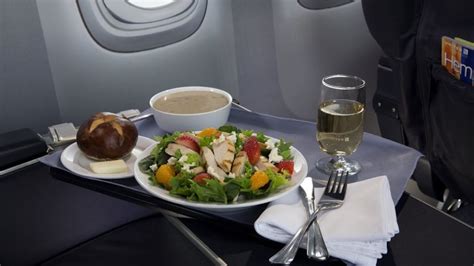 What's the deal with airline food, and why does it always taste like it was prepared in a parallel universe?